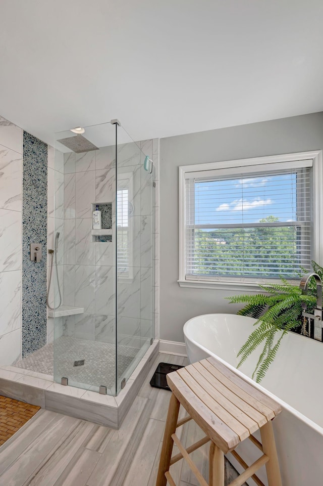 206 Stillcreek Dr, Franklin, TN 37064 - full bathroom with a stall shower, a freestanding bath, and wood finished floors