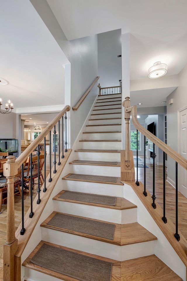206 Stillcreek Dr, Franklin, TN 37064 - stairs with wood finished floors and a chandelier