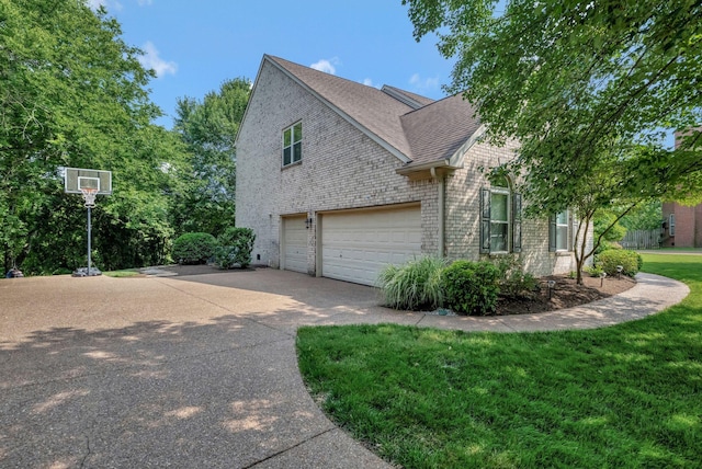 206 Stillcreek Dr, Franklin, TN 37064 - view of front of house with driveway, a shingled roof, an attached garage, brick siding, and a front lawn
