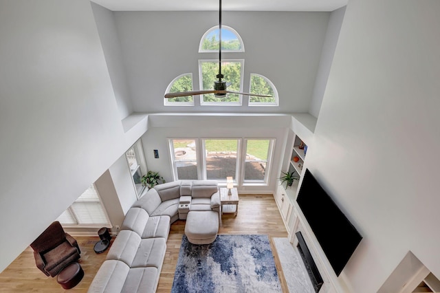 206 Stillcreek Dr, Franklin, TN 37064 - living room with a high ceiling, ceiling fan, wood finished floors, and a high end fireplace