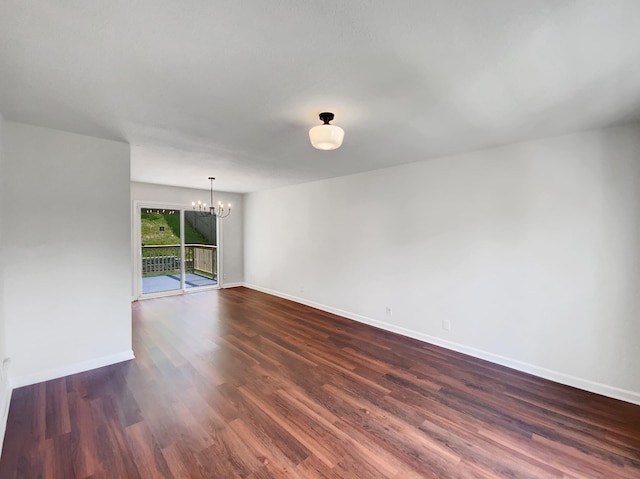480 Bamburg Dr, Clarksville, TN 37040 - unfurnished room with a chandelier and dark wood-style flooring