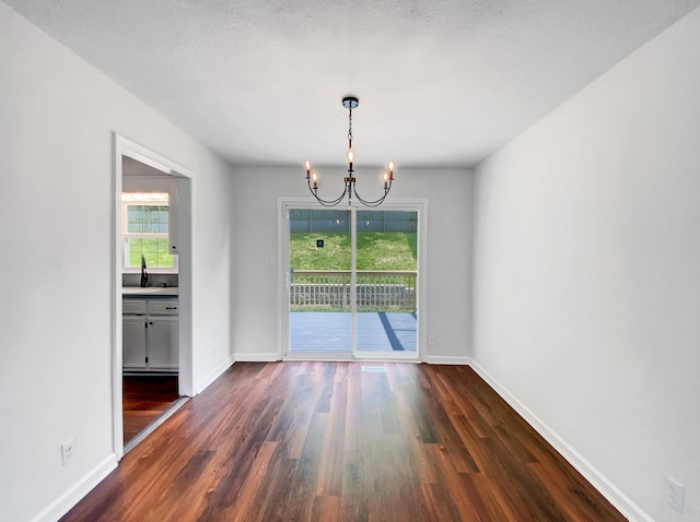 480 Bamburg Dr, Clarksville, TN 37040 - unfurnished dining area featuring a chandelier and dark wood-style floors