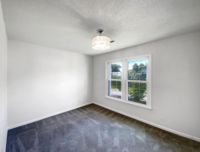 480 Bamburg Dr, Clarksville, TN 37040 - spare room with dark carpet, a textured ceiling, and a chandelier