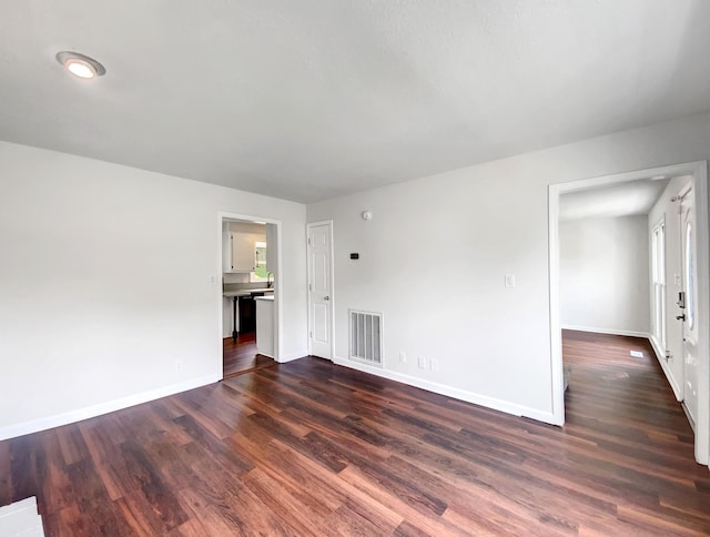480 Bamburg Dr, Clarksville, TN 37040 - unfurnished living room with dark wood-style floors and baseboards