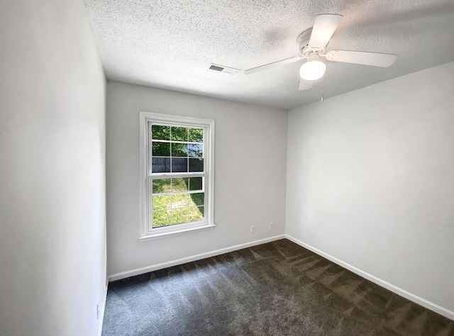 480 Bamburg Dr, Clarksville, TN 37040 - spare room with dark carpet, ceiling fan, and a textured ceiling