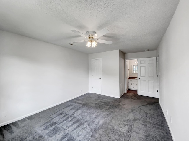 480 Bamburg Dr, Clarksville, TN 37040 - unfurnished bedroom with a textured ceiling, dark colored carpet, and a ceiling fan