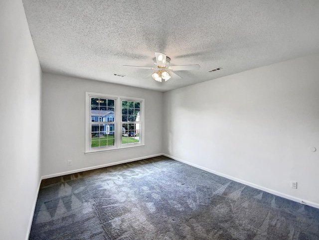 480 Bamburg Dr, Clarksville, TN 37040 - empty room featuring a ceiling fan, dark colored carpet, and a textured ceiling