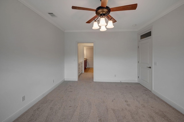 301 Criddle St Unit 304, Nashville, TN 37219 - spare room featuring ornamental molding, a ceiling fan, and light carpet