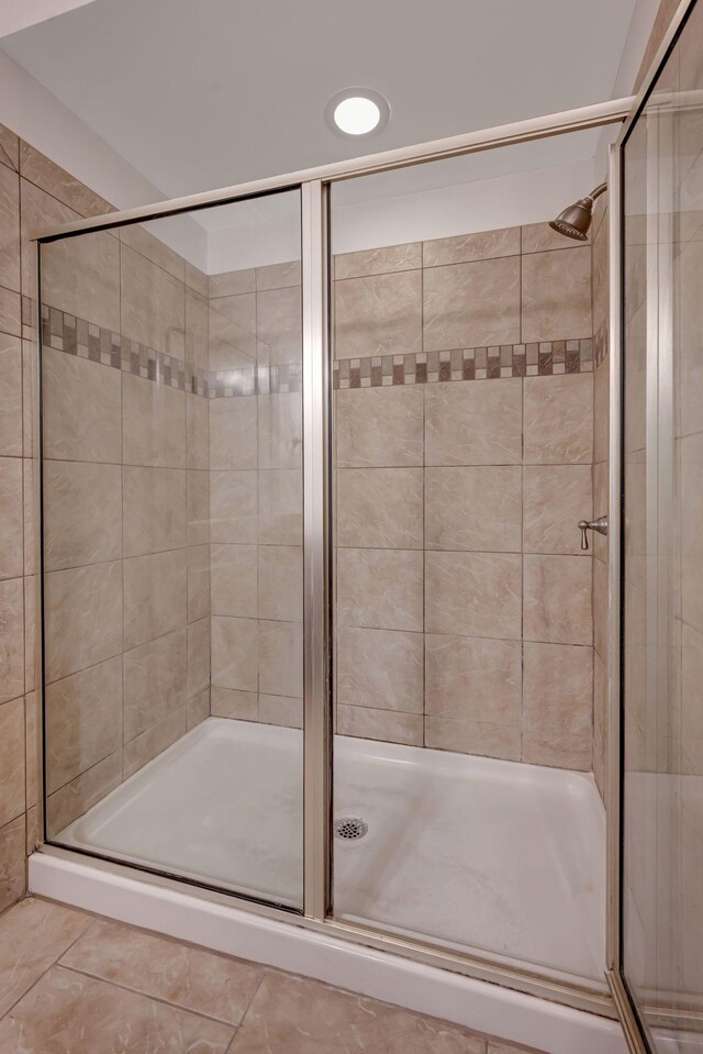 301 Criddle St Unit 304, Nashville, TN 37219 - bathroom featuring a stall shower and tile patterned flooring