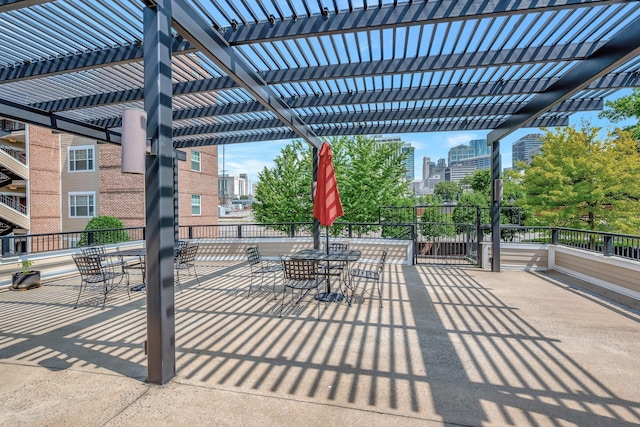 301 Criddle St Unit 304, Nashville, TN 37219 - view of patio / terrace featuring a pergola, outdoor dining area, and a view of city