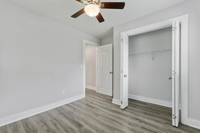 49 Je Sartain Rd, Manchester, TN 37355 - unfurnished bedroom featuring wood finished floors, a closet, and ceiling fan