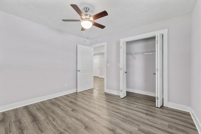 49 Je Sartain Rd, Manchester, TN 37355 - unfurnished bedroom featuring wood finished floors, a closet, and ceiling fan