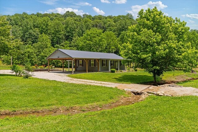 49 Je Sartain Rd, Manchester, TN 37355 - view of front of home with driveway, an attached carport, and a front lawn