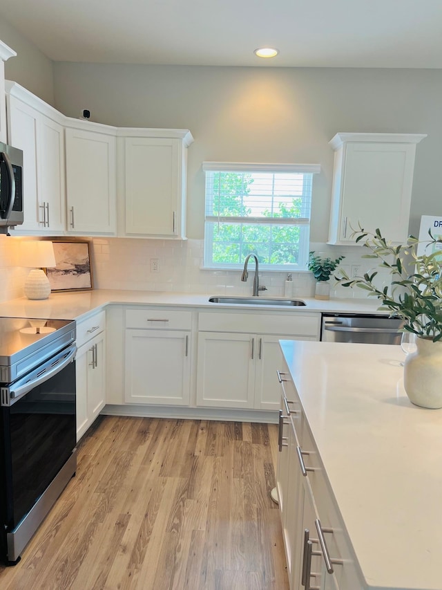 235 Dry Creek Commons, Goodlettsville, TN 37072 - kitchen featuring stainless steel appliances, white cabinets, recessed lighting, and light countertops