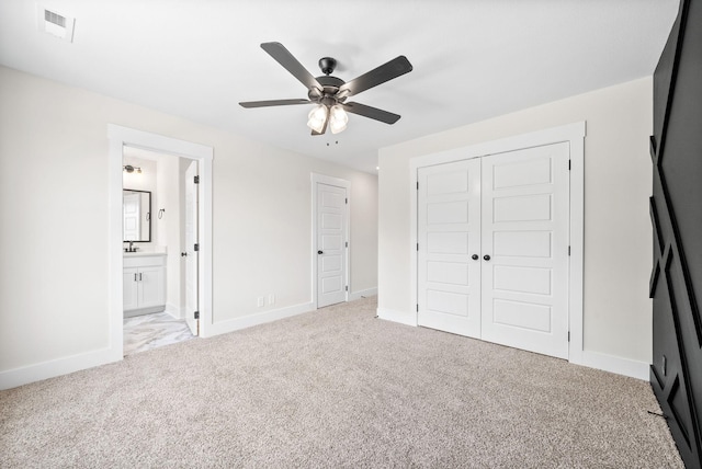 198 Cave St Unit C, Clarksville, TN 37042 - unfurnished bedroom with light colored carpet, a closet, connected bathroom, and ceiling fan