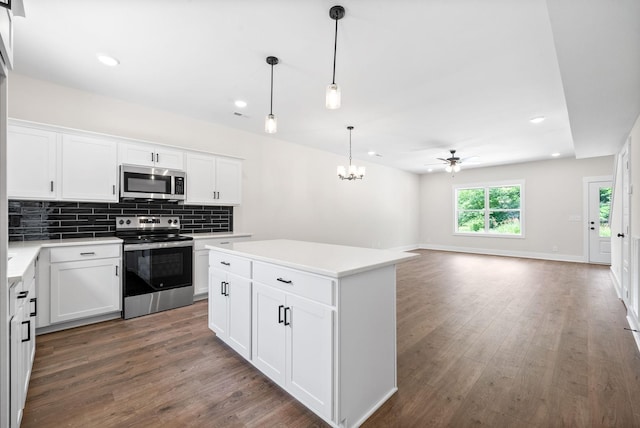 198 Cave St Unit C, Clarksville, TN 37042 - kitchen with stainless steel appliances, a ceiling fan, wood finished floors, decorative backsplash, and recessed lighting