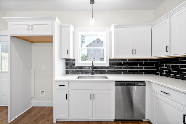 198 Cave St Unit C, Clarksville, TN 37042 - kitchen featuring stainless steel dishwasher, decorative backsplash, dark wood finished floors, white cabinetry, and hanging light fixtures