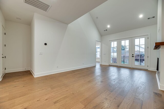 117 Shadow Springs Dr Unit 117, Brentwood, TN 37027 - unfurnished living room with light wood finished floors, high vaulted ceiling, french doors, and recessed lighting