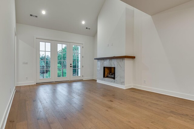 117 Shadow Springs Dr Unit 117, Brentwood, TN 37027 - unfurnished living room featuring wood finished floors, a fireplace, high vaulted ceiling, and recessed lighting