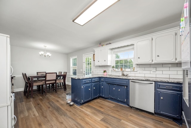 229 Wellington Way, Smyrna, TN 37167 - kitchen featuring stainless steel dishwasher, blue cabinets, a peninsula, and white cabinets