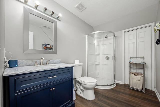 229 Wellington Way, Smyrna, TN 37167 - full bath featuring a shower stall, wood finished floors, vanity, and a textured ceiling