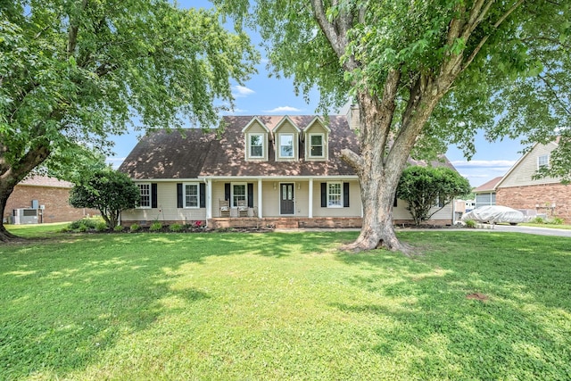 229 Wellington Way, Smyrna, TN 37167 - cape cod house featuring covered porch, a front yard, and a chimney