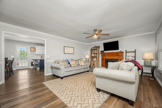 229 Wellington Way, Smyrna, TN 37167 - living area with a fireplace, dark wood-type flooring, a ceiling fan, and crown molding