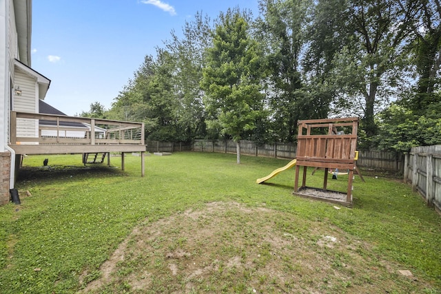 2135 Loudenslager Dr, Thompsons Station, TN 37179 - fenced backyard featuring a playground and a deck