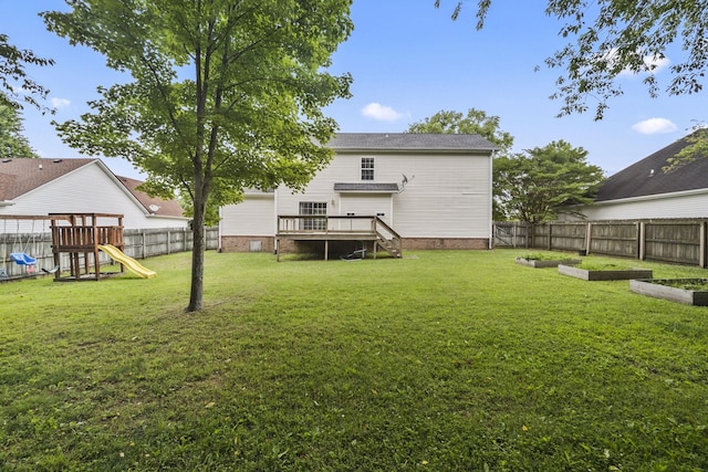 2135 Loudenslager Dr, Thompsons Station, TN 37179 - fenced backyard featuring a playground, a garden, and a wooden deck