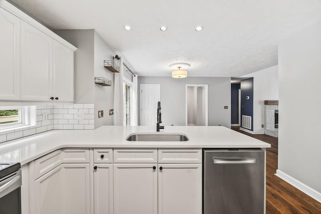 2135 Loudenslager Dr, Thompsons Station, TN 37179 - kitchen featuring a peninsula, white cabinets, recessed lighting, dark wood-style flooring, and plenty of natural light