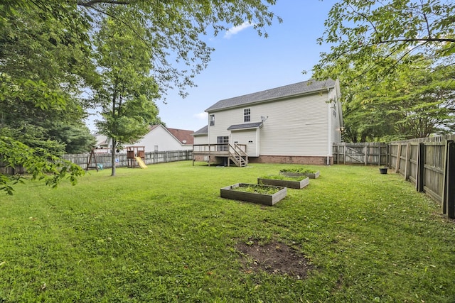 2135 Loudenslager Dr, Thompsons Station, TN 37179 - fenced backyard featuring a playground, a garden, and a deck