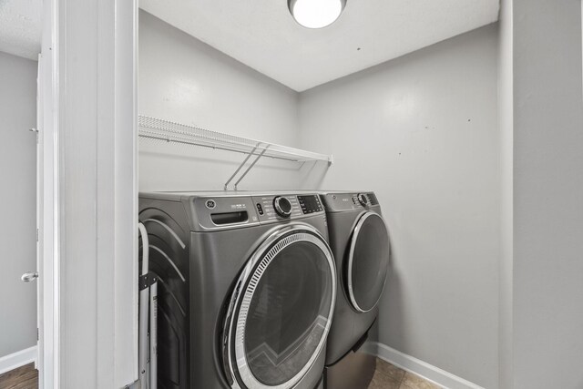 2135 Loudenslager Dr, Thompsons Station, TN 37179 - laundry area with washer and dryer and baseboards