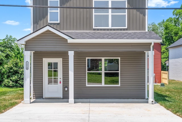 109 Adkins St Unit A, Clarksville, TN 37042 - view of front of property with board and batten siding, covered porch, and roof with shingles