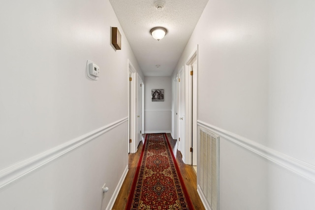 1651 Caughran Rd, Lewisburg, TN 37091 - corridor with wood finished floors and a textured ceiling