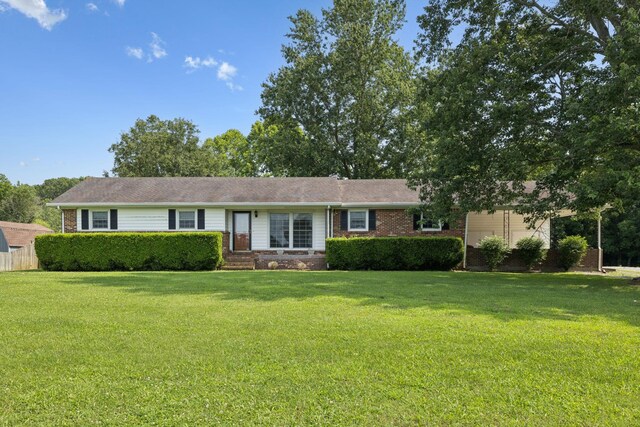 1651 Caughran Rd, Lewisburg, TN 37091 - single story home with brick siding and a front yard