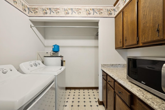 1651 Caughran Rd, Lewisburg, TN 37091 - washroom featuring separate washer and dryer, light flooring, and cabinet space