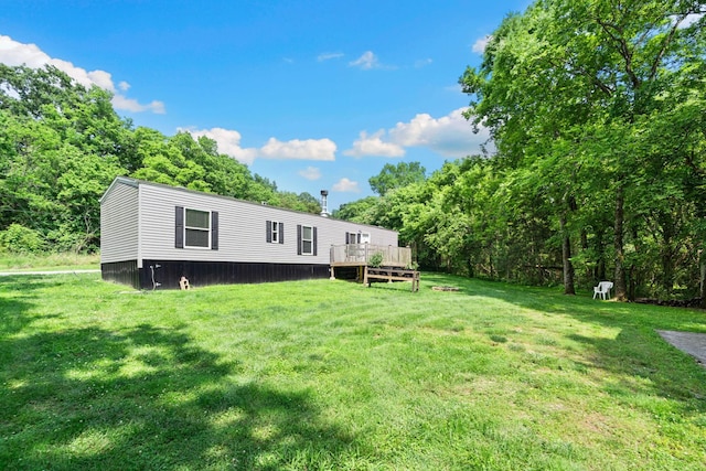 2113 Culleoka Hwy, Culleoka, TN 38451 - rear view of property featuring a deck, a lawn, and a wooded view