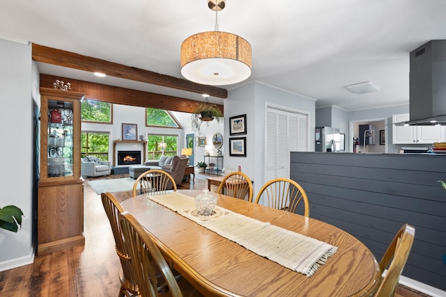 2113 Culleoka Hwy, Culleoka, TN 38451 - dining room featuring wood finished floors and a warm lit fireplace