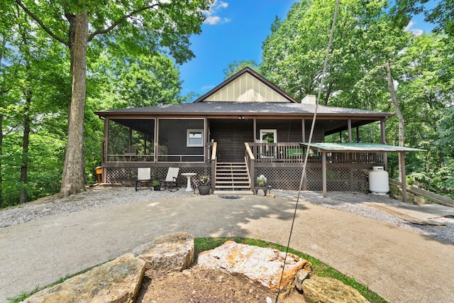 2113 Culleoka Hwy, Culleoka, TN 38451 - view of front of home featuring board and batten siding and a sunroom