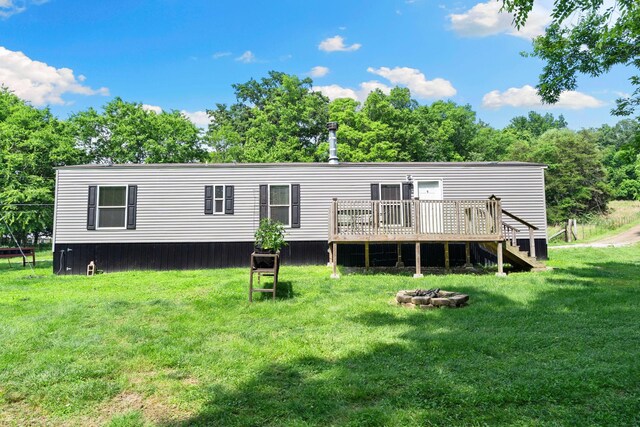 2113 Culleoka Hwy, Culleoka, TN 38451 - rear view of property with an outdoor fire pit, a wooden deck, and a yard
