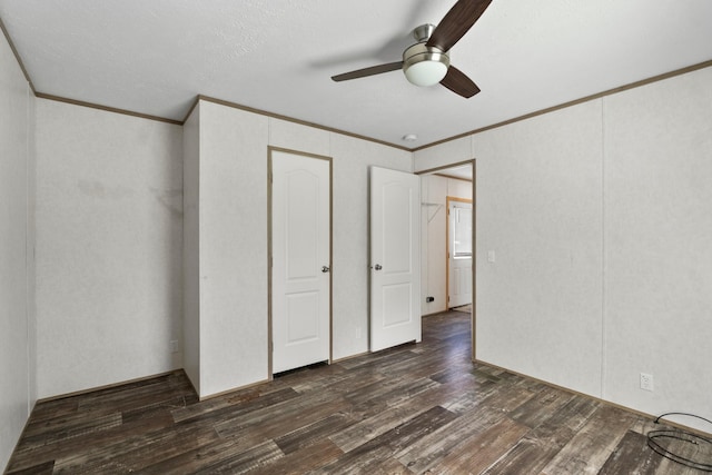 2113 Culleoka Hwy, Culleoka, TN 38451 - unfurnished bedroom with ornamental molding, dark wood finished floors, a ceiling fan, and a closet