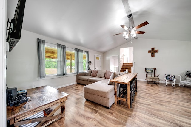 3037 Tunnel Rd, Westmoreland, TN 37186 - living area featuring lofted ceiling, a ceiling fan, light wood-style flooring, and stairs
