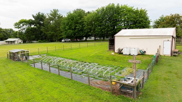 3037 Tunnel Rd, Westmoreland, TN 37186 - view of yard featuring a vegetable garden, an outdoor structure, and a pole building