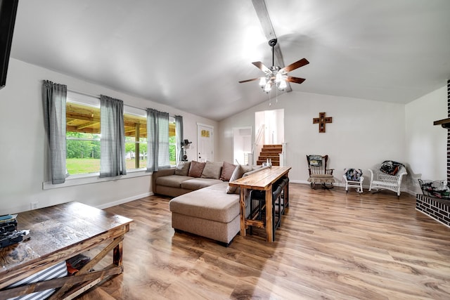 3037 Tunnel Rd, Westmoreland, TN 37186 - living room featuring vaulted ceiling, ceiling fan, wood finished floors, and stairway