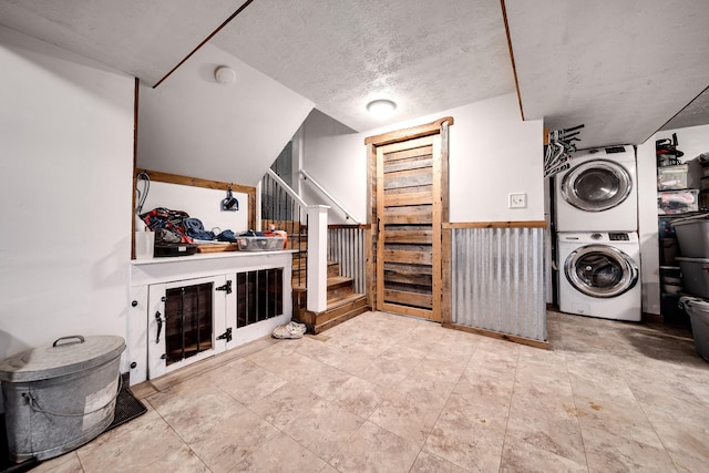 3037 Tunnel Rd, Westmoreland, TN 37186 - washroom with stacked washer / drying machine