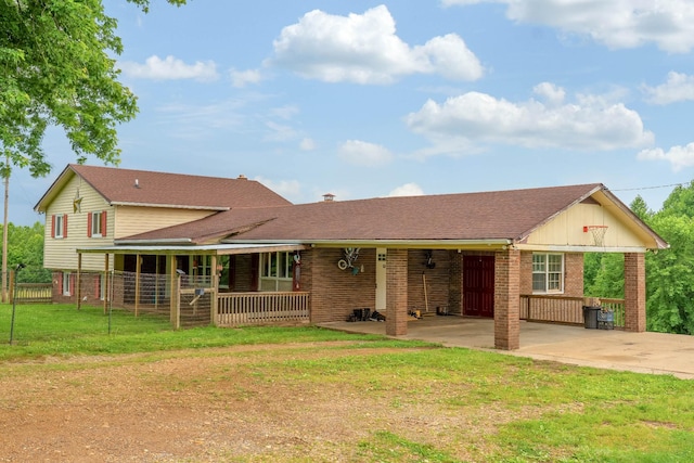 3037 Tunnel Rd, Westmoreland, TN 37186 - rear view of house featuring driveway, brick siding, and covered porch