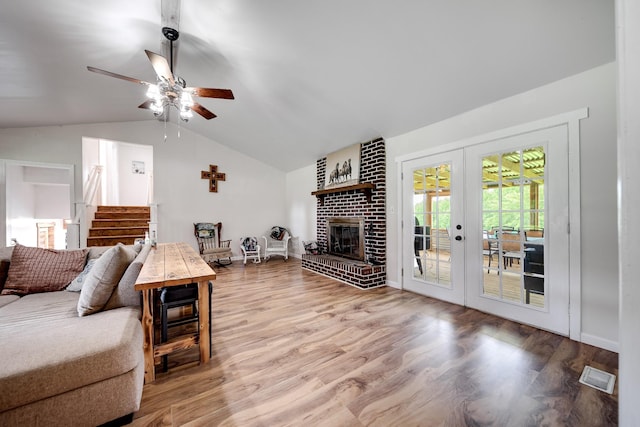 3037 Tunnel Rd, Westmoreland, TN 37186 - living room featuring lofted ceiling, french doors, ceiling fan, wood finished floors, and a fireplace