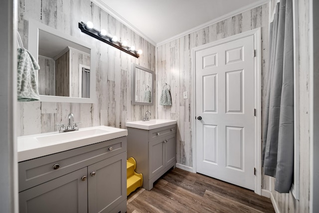 3037 Tunnel Rd, Westmoreland, TN 37186 - bathroom featuring two vanities, crown molding, and wood finished floors