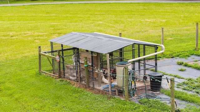 3037 Tunnel Rd, Westmoreland, TN 37186 - surrounding community with an outdoor structure, a lawn, and exterior structure