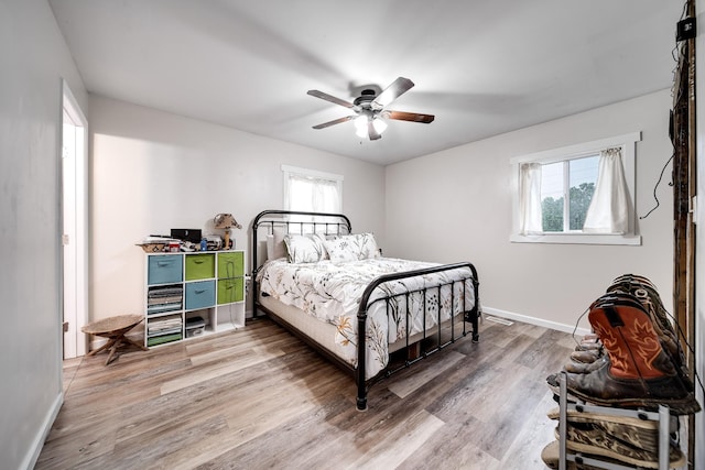3037 Tunnel Rd, Westmoreland, TN 37186 - bedroom with multiple windows, wood finished floors, and ceiling fan